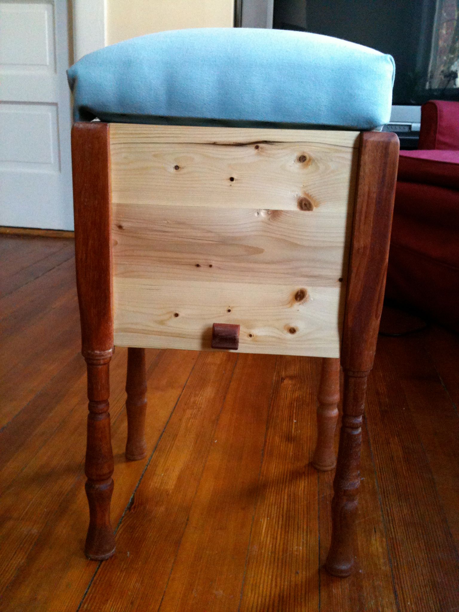 Footstool with hidden sliding storage compartment