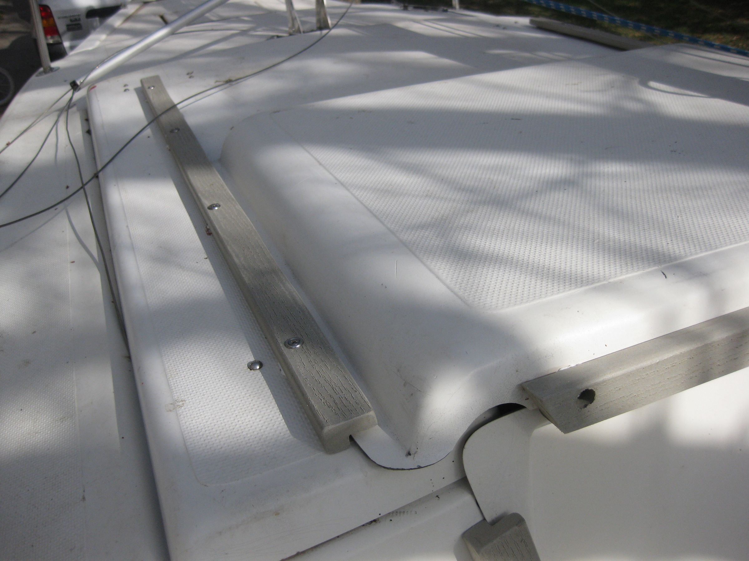 Replace Wood Hatch Slides on Sailboat With Composite Decking Material