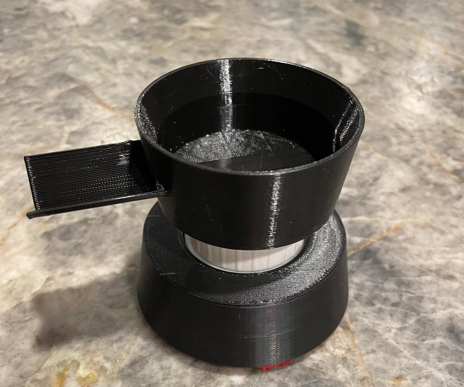 The Adjustable Drinking Cup From a Faucet for Your Cat