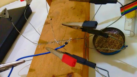 With the Help of Helping Hands Solder the Pin to Wire