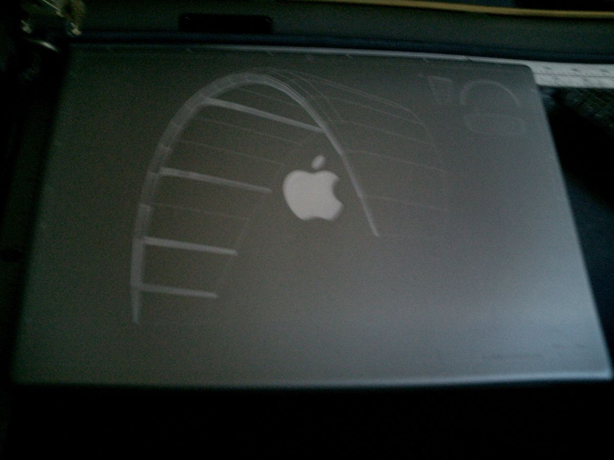 Laser Etching Macintosh Powerbooks.