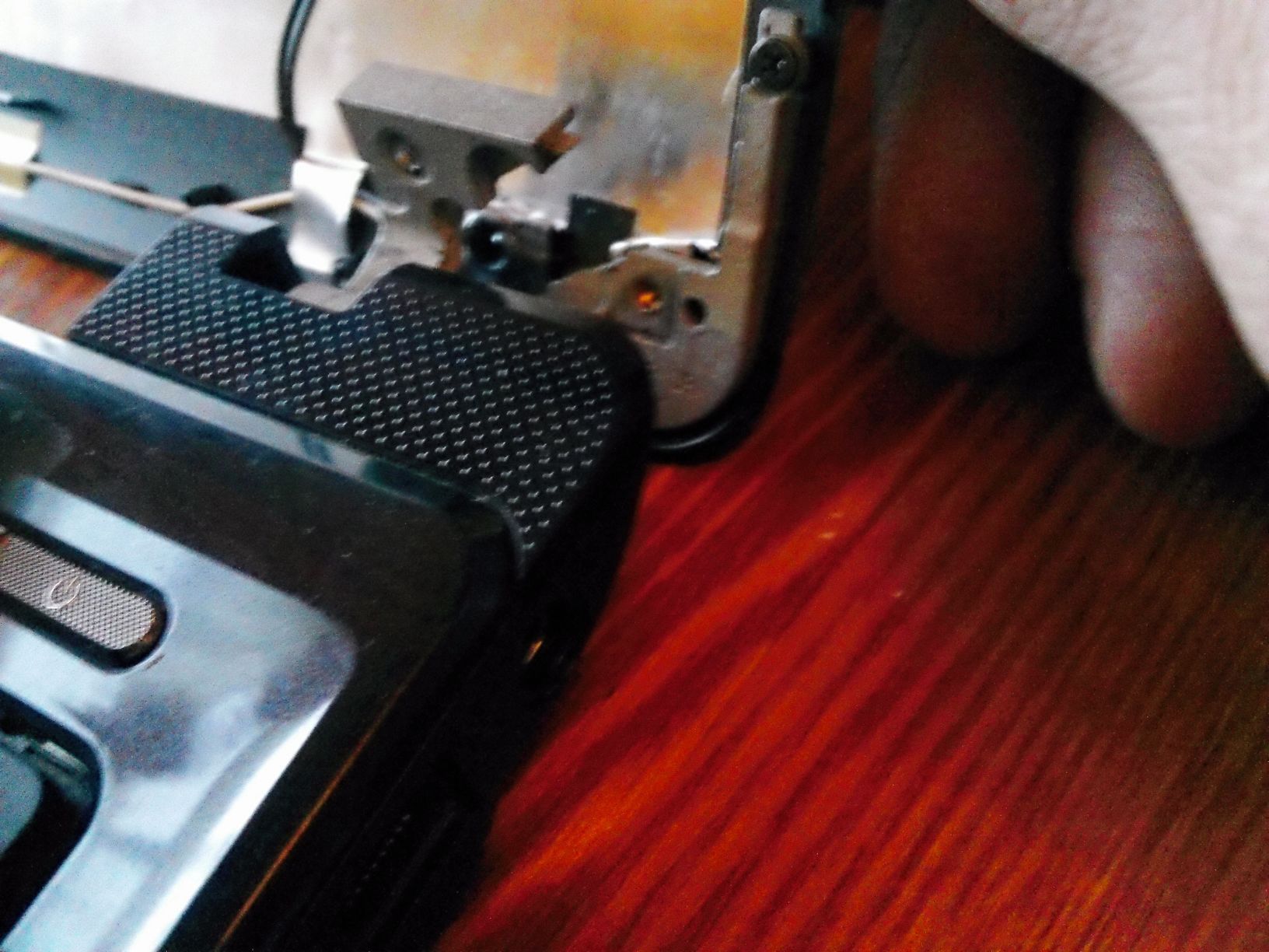 Repair broken hinge on a notebook.