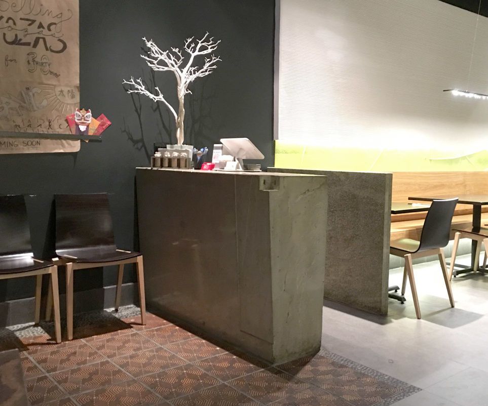 Concrete Hostess Station for Green Zone Restaurant