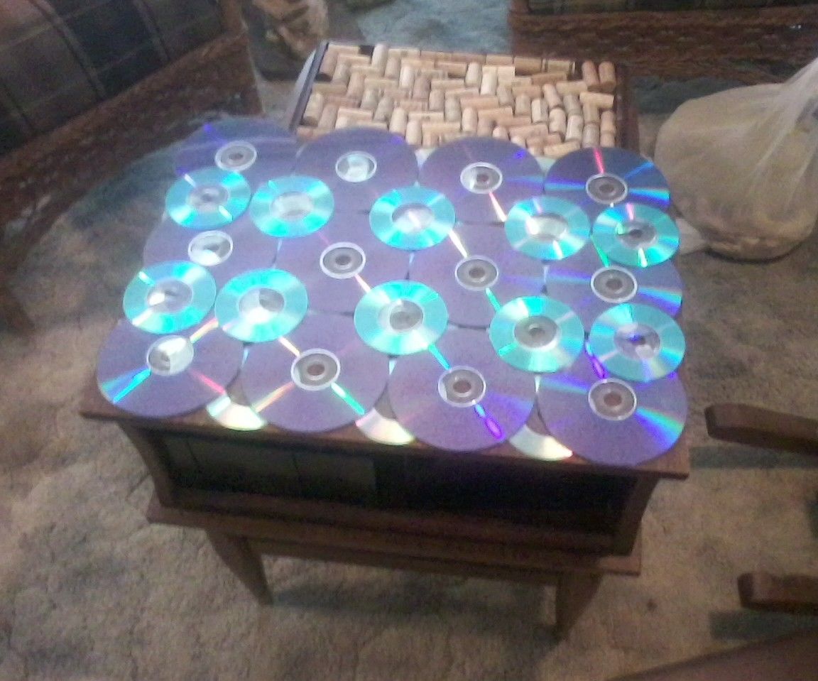 End Table Covered With CDs and Corks