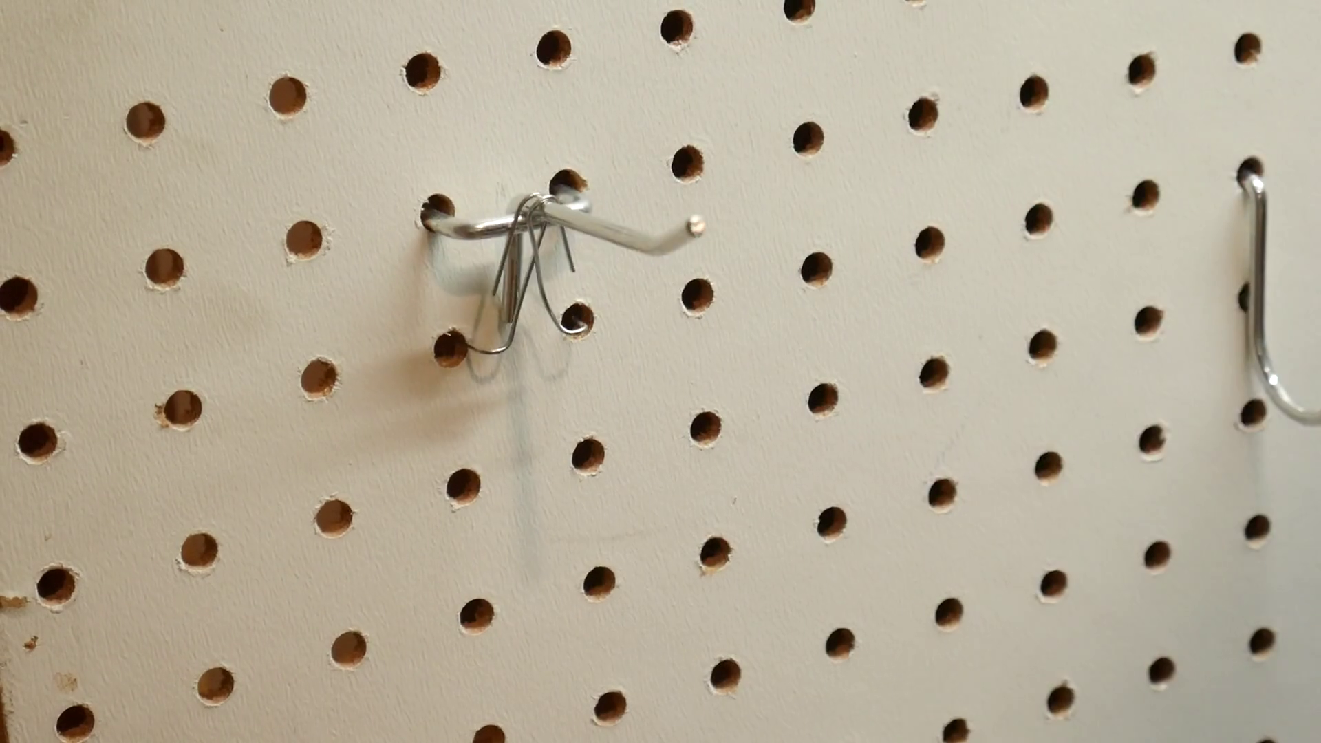 Keep Pegboard Hooks From Falling Out, How to Quickly Secure Any Pegboard Hook With a Paperclip