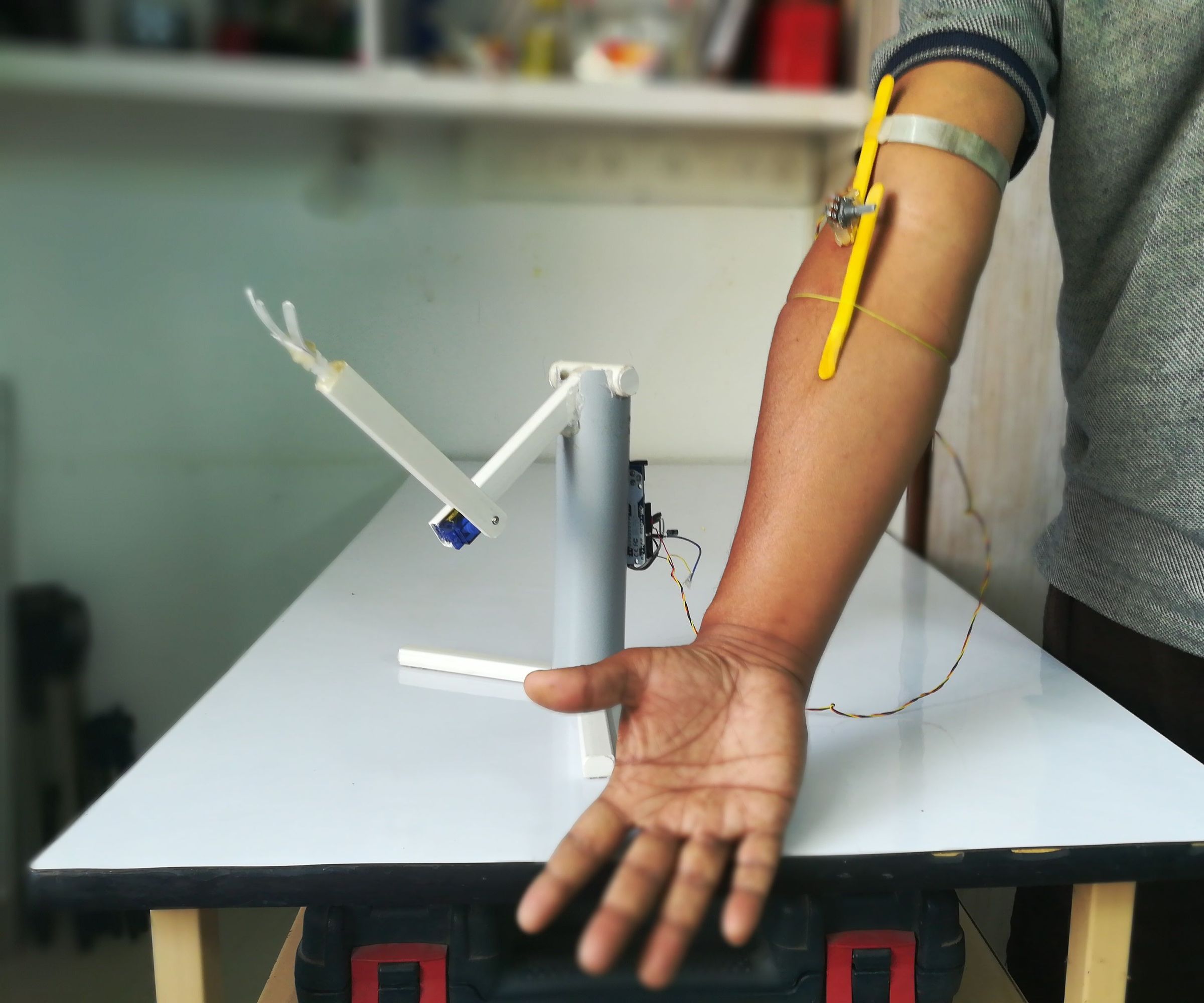 A Simple Robotic Arm Controlled Over Actual Hand Movement