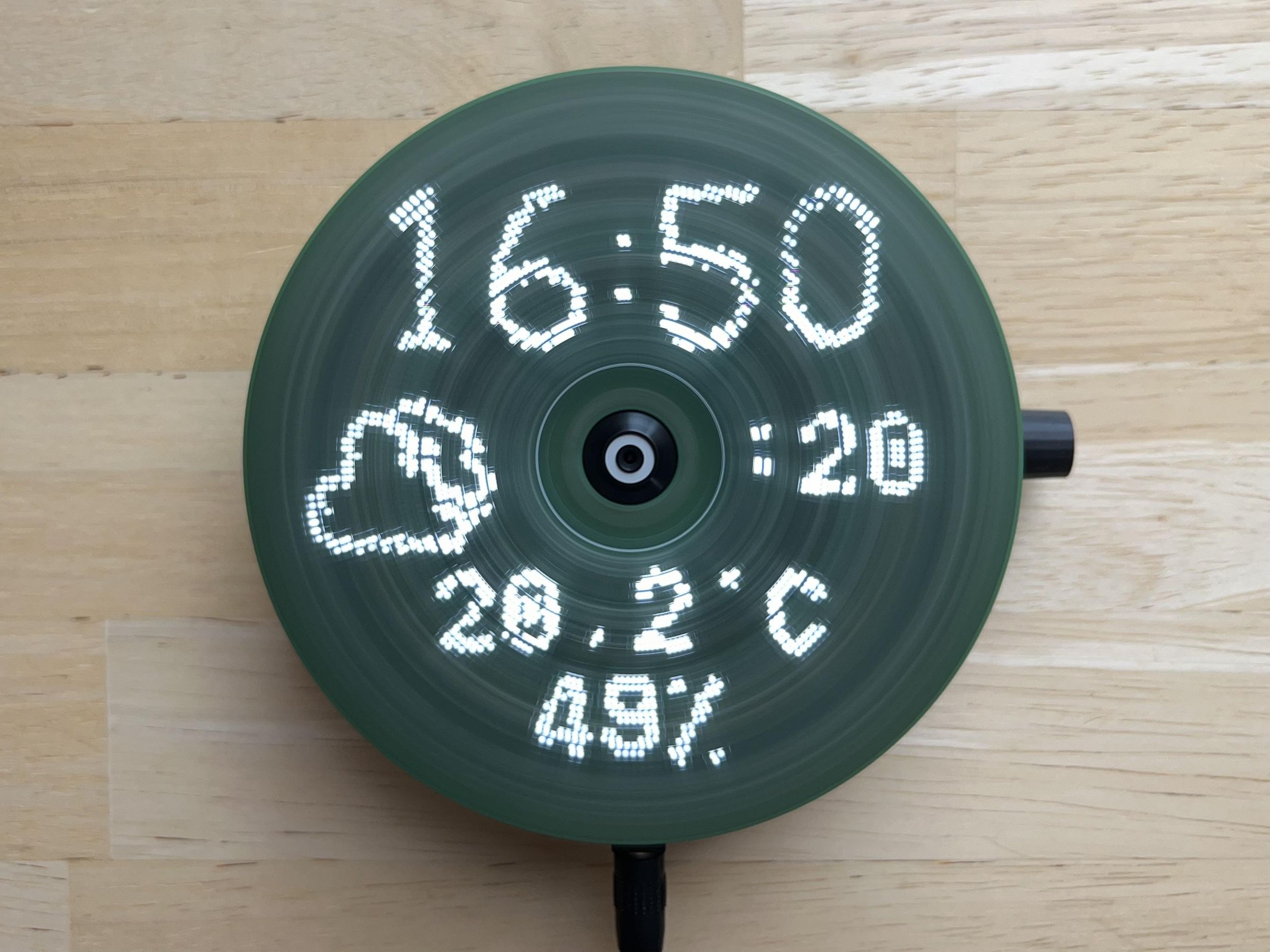 a compact disc-sized display that uses a single line of 40 LEDs, and rotates using a CD motor to fill a circular space with an image
