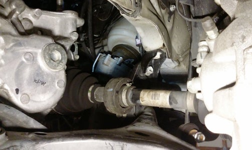 Replace the Left Axle and Reattach the Control Arms. 