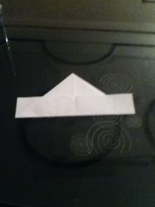 Know Turn Over the Paper and Fold Up the Other End.