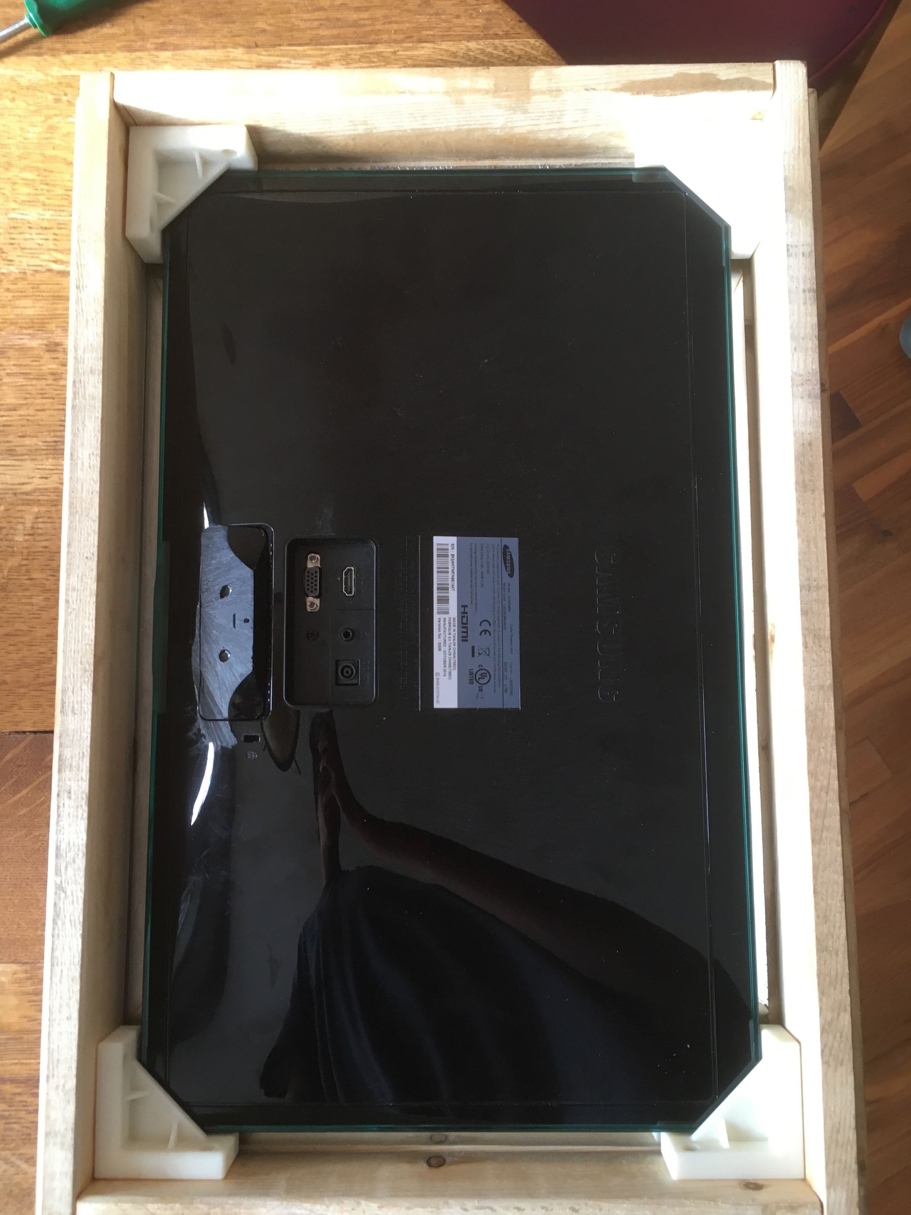 Monitor mounted behind mirror