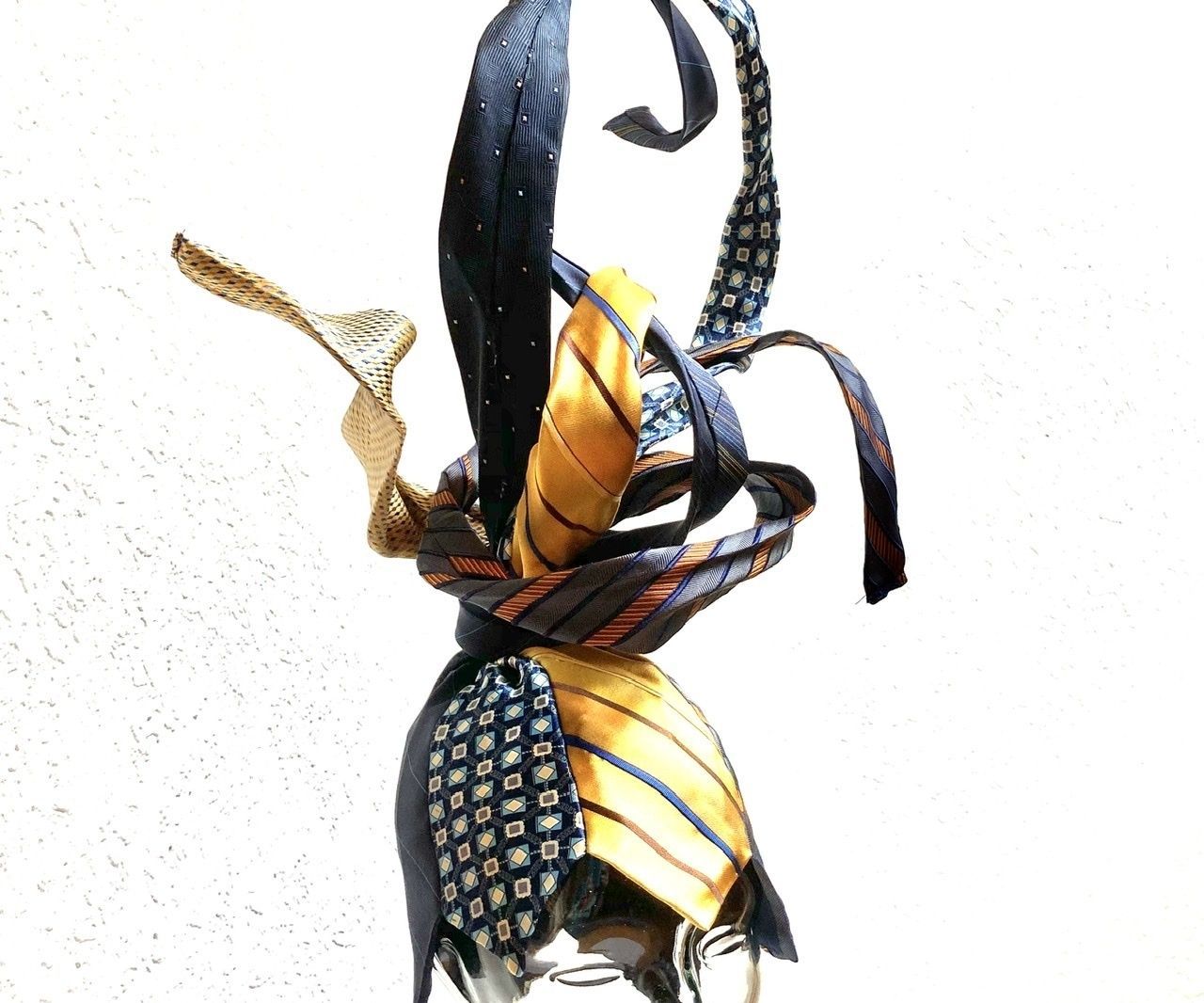 Ties to Swirly Hat