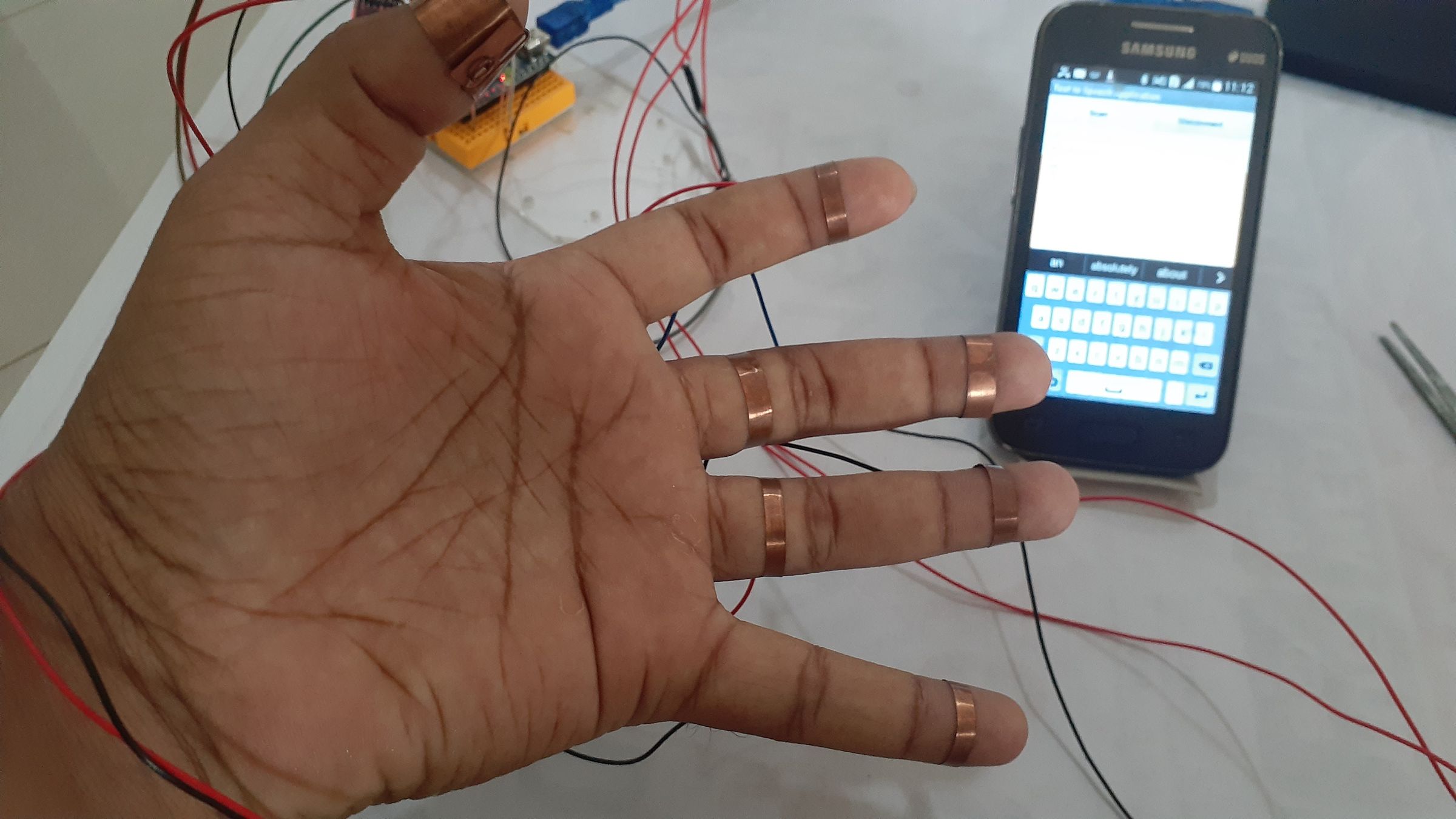 Wearable Keyboard on Fingers That Leads to Word Pronunciation on Phone