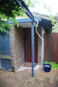 Home Made Hardwood Door and Ledgestone Entry