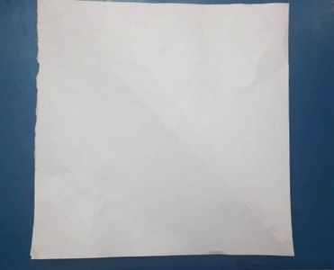 Fold It Diagonally, So That It Looks Like Triangle. And, Then Unfold It.