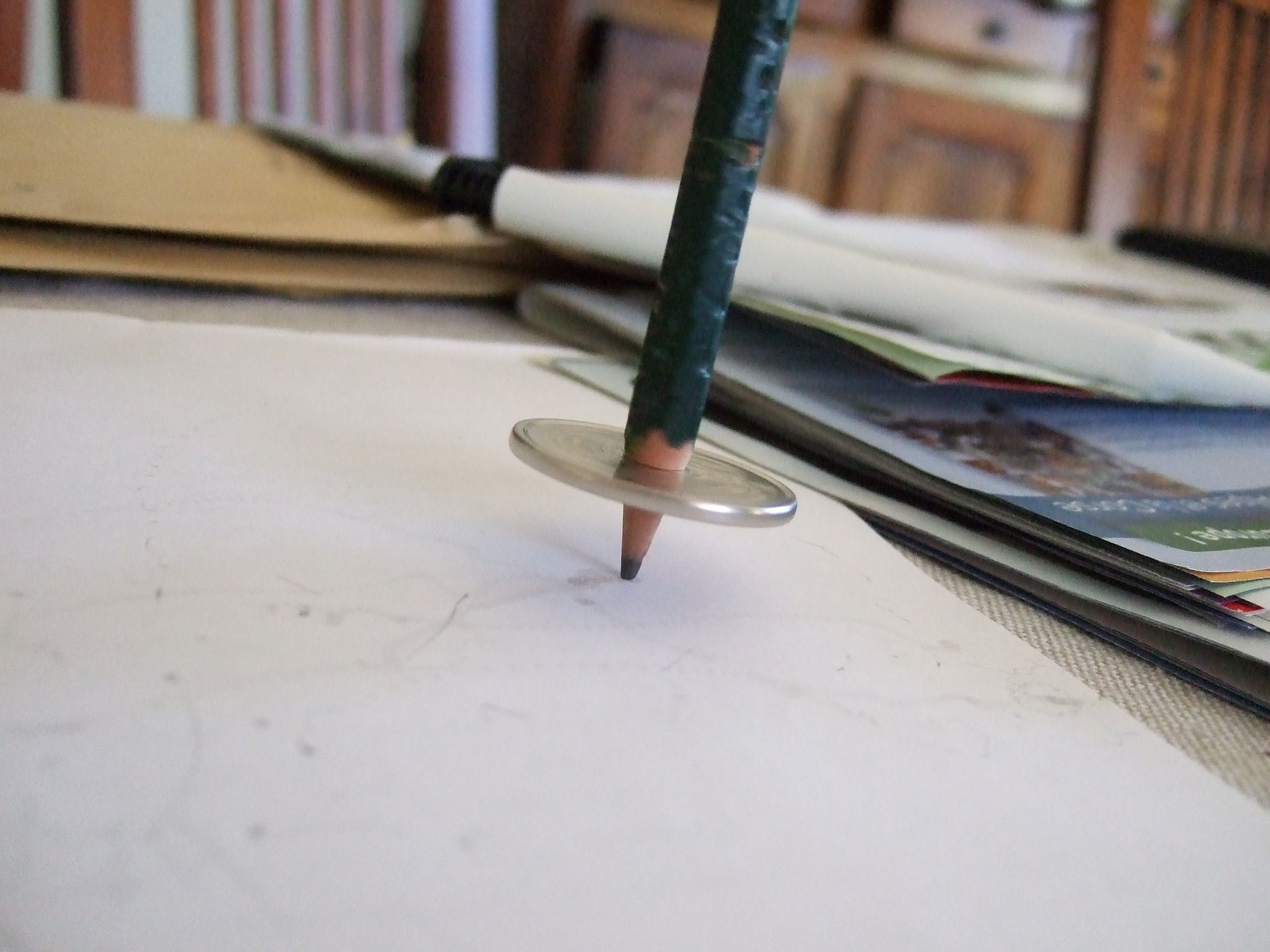 Pencil and Coin Spinning Top