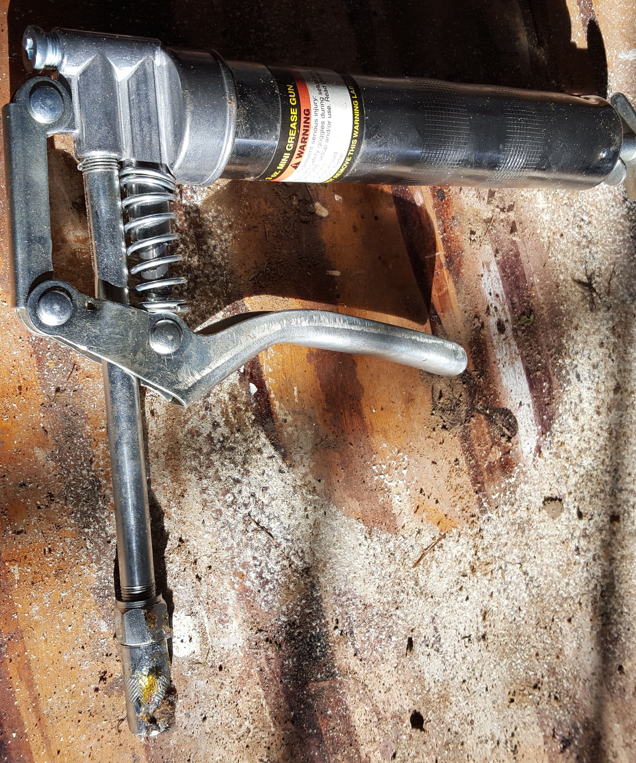 Storing a Grease Gun Without the Mess. Instructables