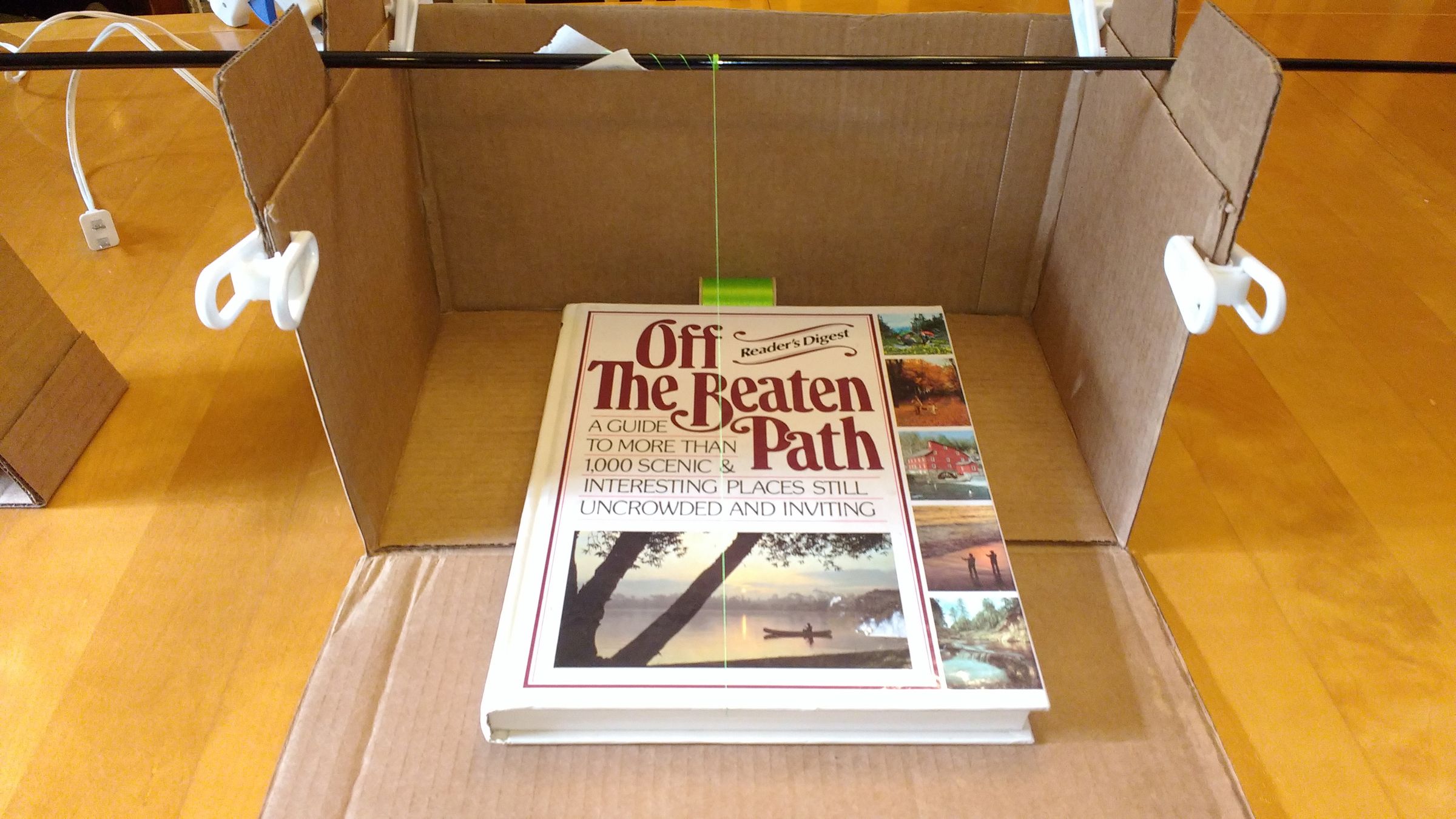 Make a Free/Inexpensive Fishing Rod Wrapping Jig Out of a Cardboard Box