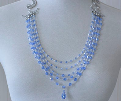 Teal glass bead choker on teal aluminum wire.