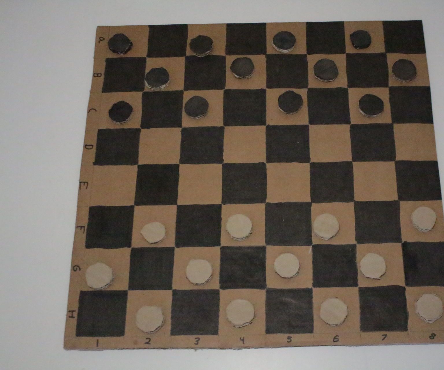DIY guide for Awesome Cardboard Checkers with step-by-step instructions