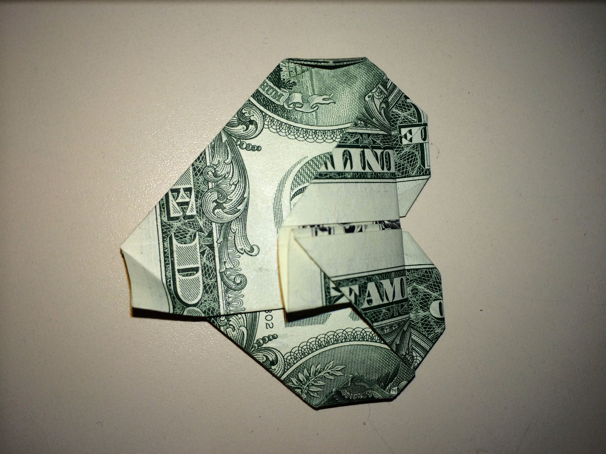 Dollar Origami Heart Holding Quarter : 11 Steps - Instructables
