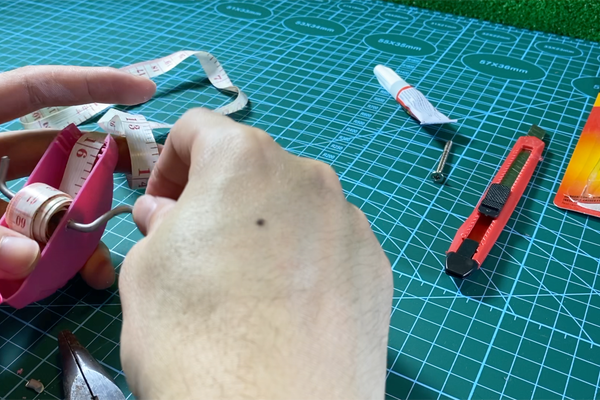 Rolling the Sewing Ruler in to the Box