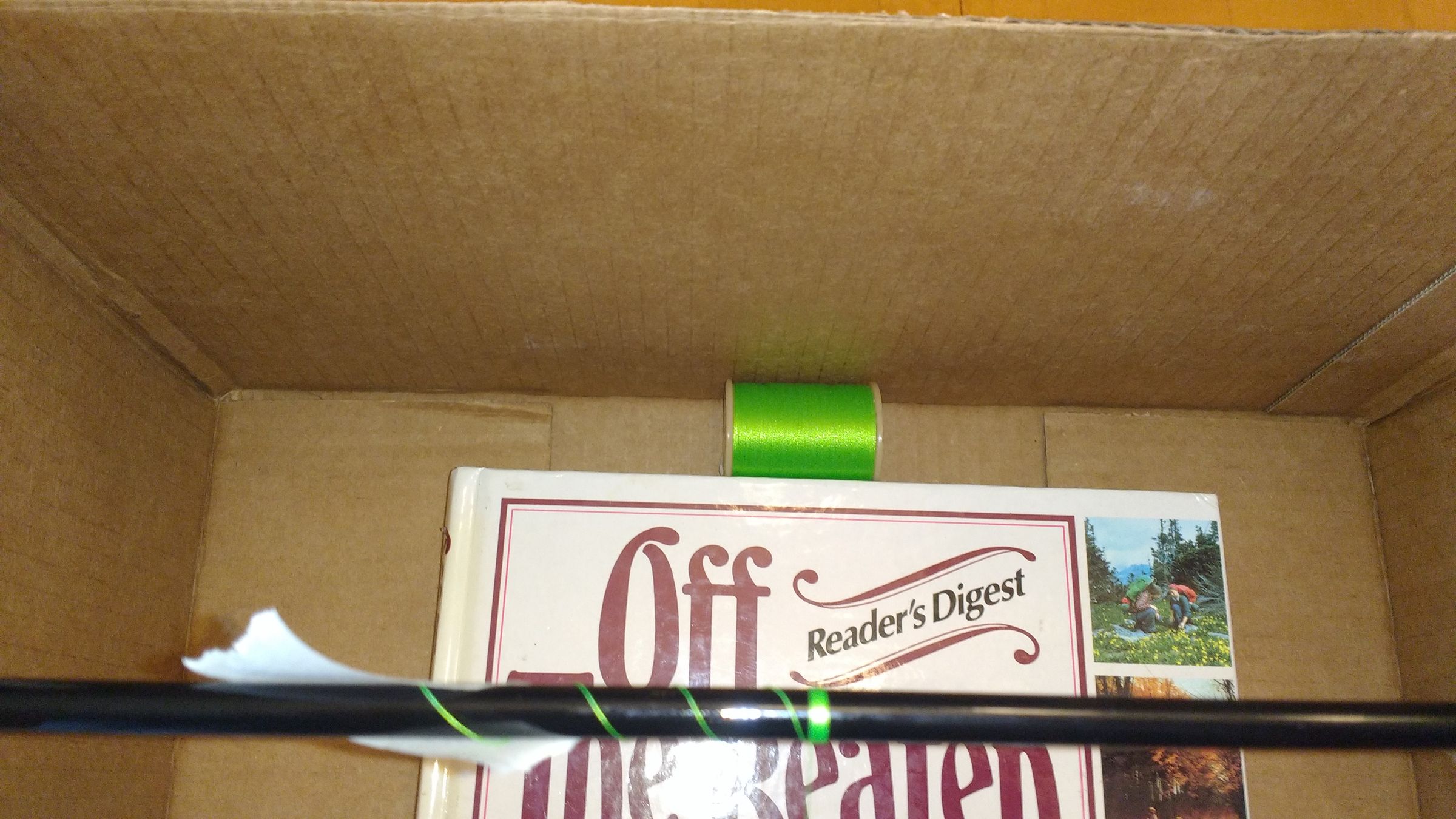Make a Free/Inexpensive Fishing Rod Wrapping Jig Out of a Cardboard Box