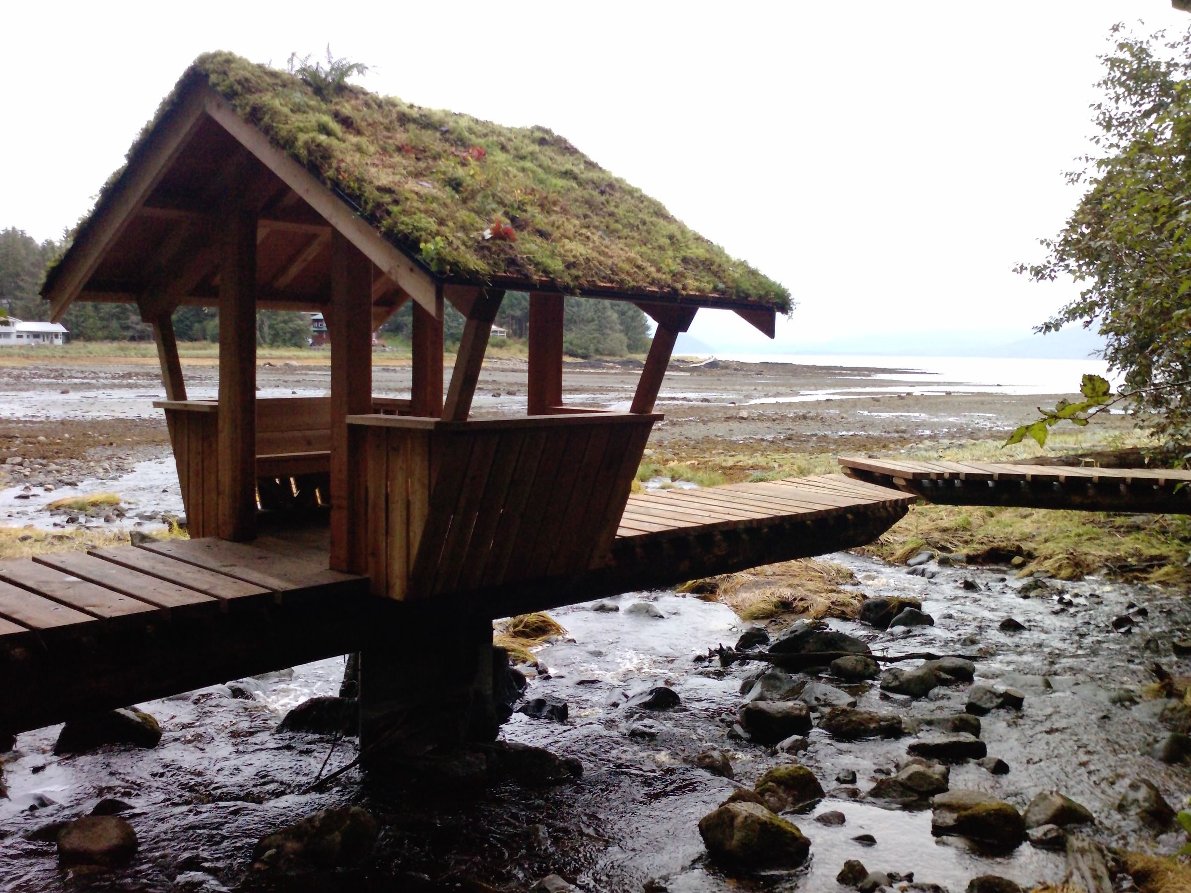 A Cantilevered Foot Bridge Out of Logs - With a Hut!