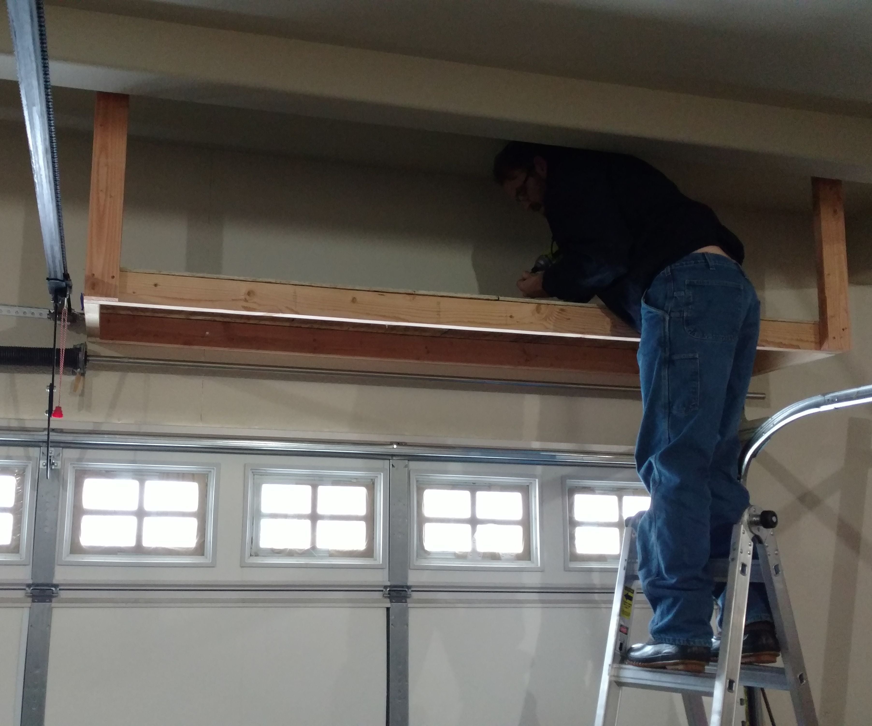Over Garage Door Shelving 5 Steps With Pictures Instructables Over Garage Door Shelving 5, Garage Door Storage Diy