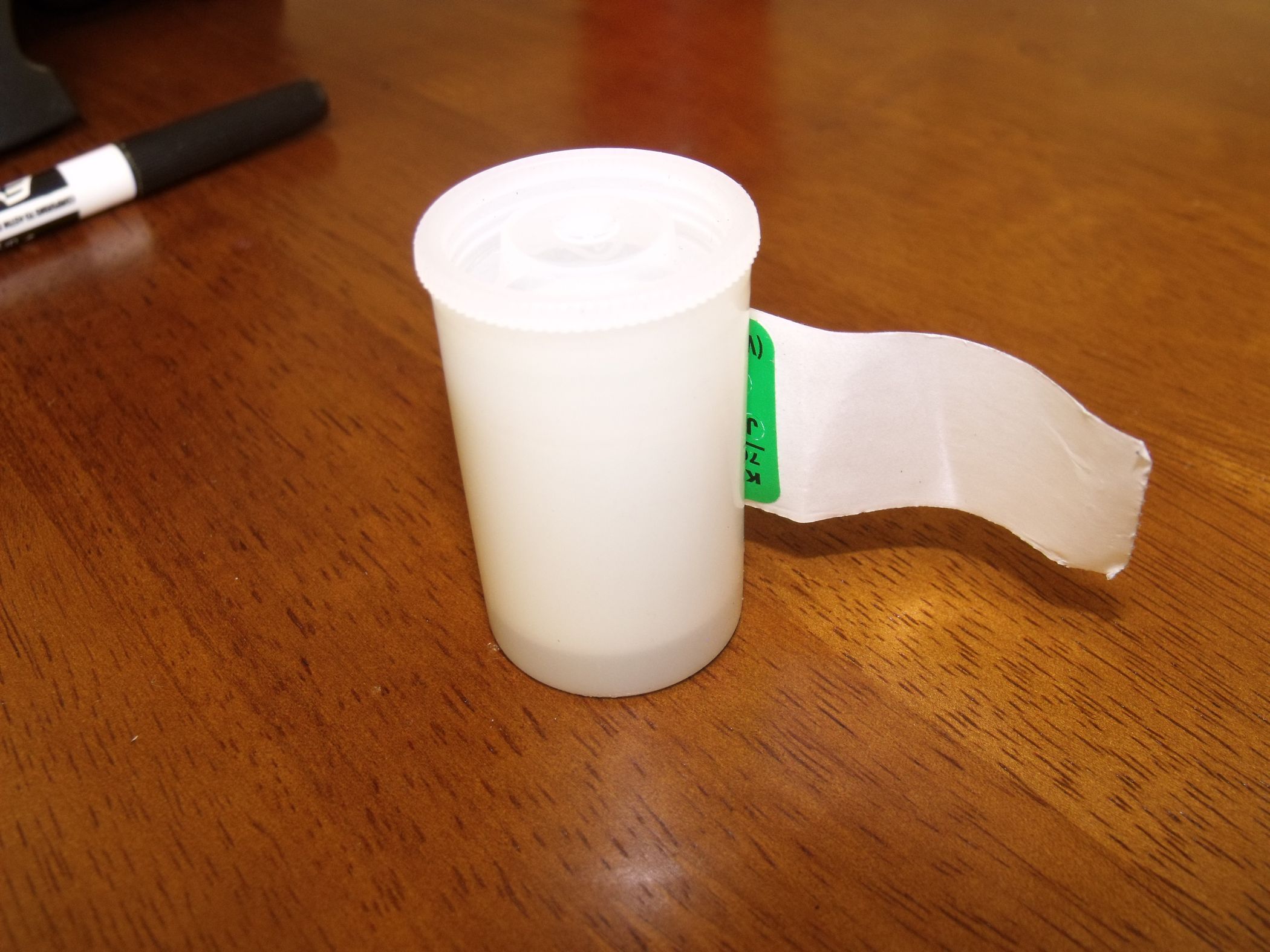 Make a Sticker Dispenser Out of a Film Container 4 Steps Instructables
