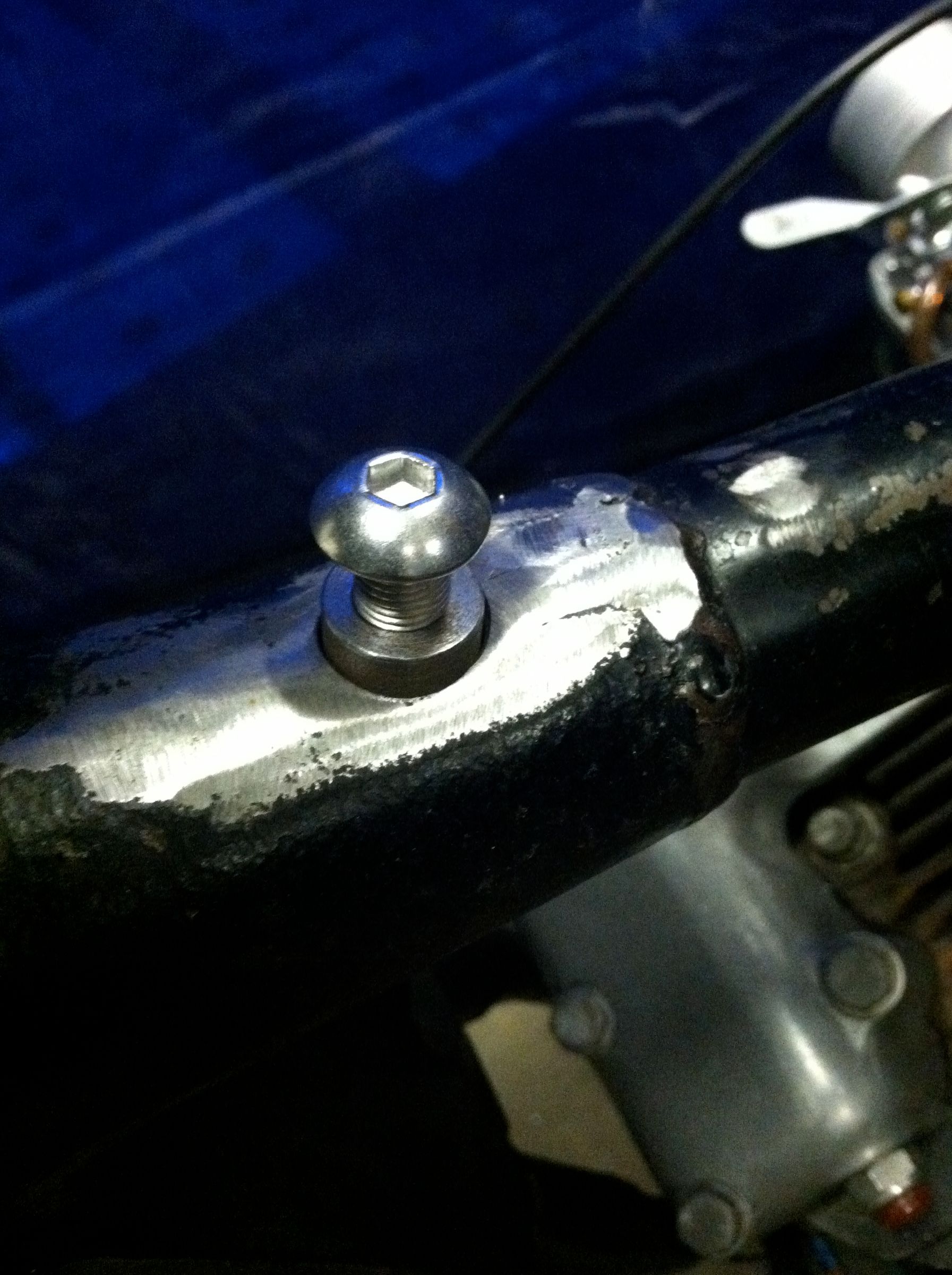 DIY guide for TIG Welding Mild Steel Bungs into the Backbone of Your Early Model Harley Davidson Sportster with step-by-step instructions