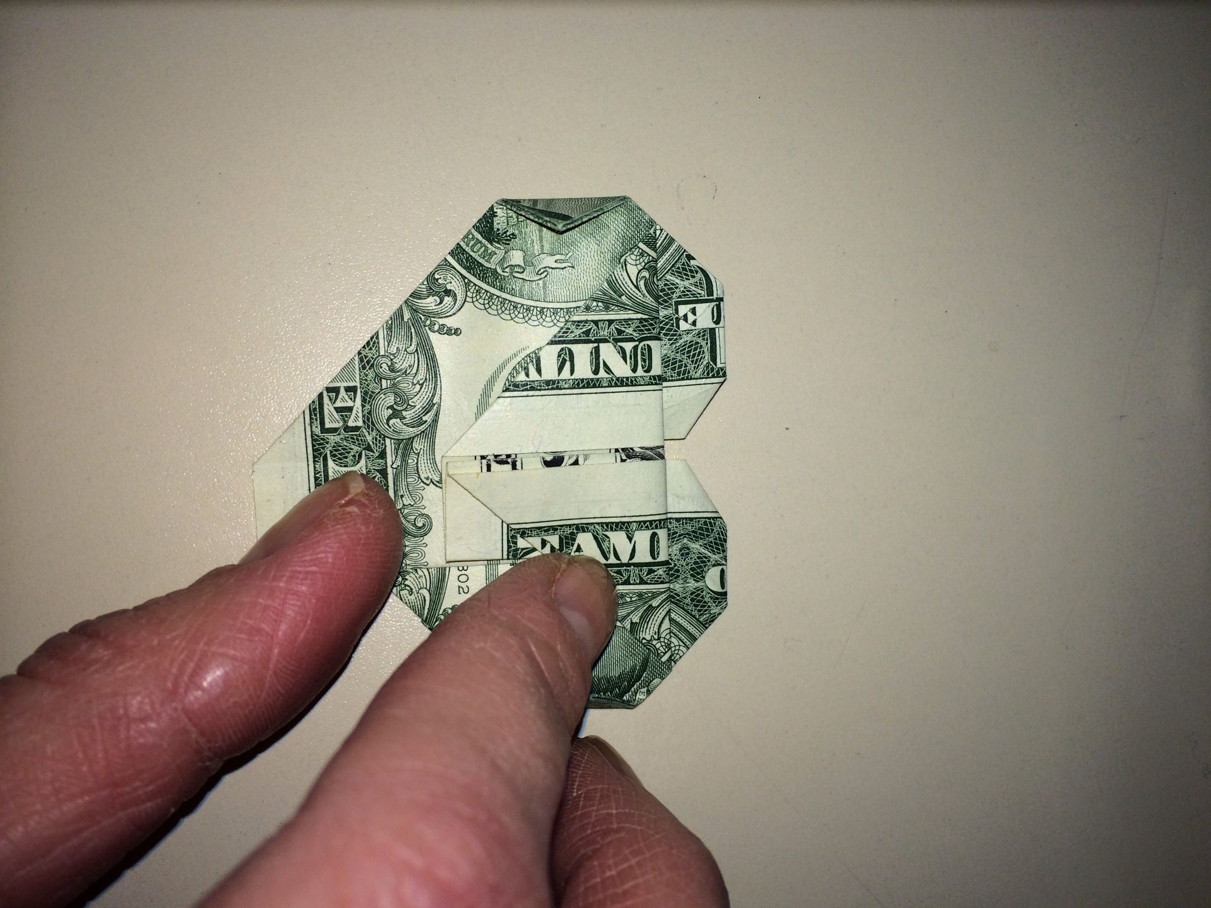 Dollar Origami Heart Holding Quarter : 11 Steps - Instructables