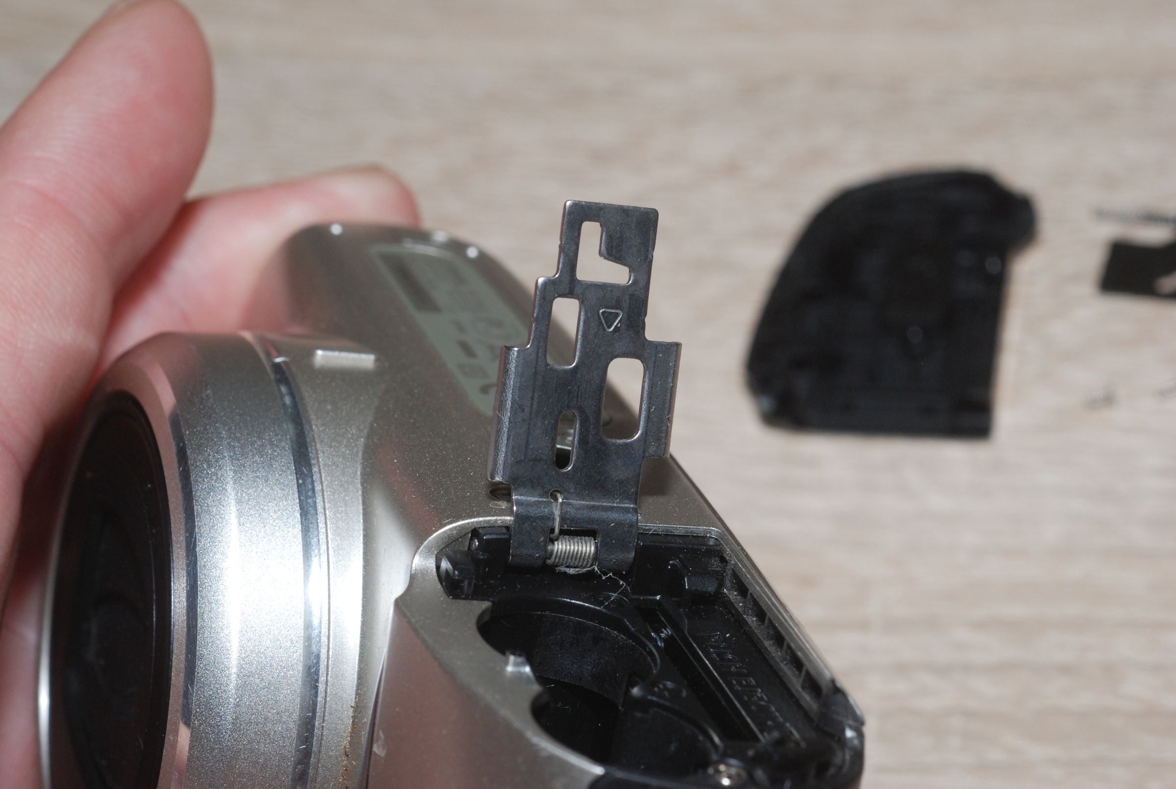Replacement of Canon PowerShot SX130IS Battery Compartment Door 4