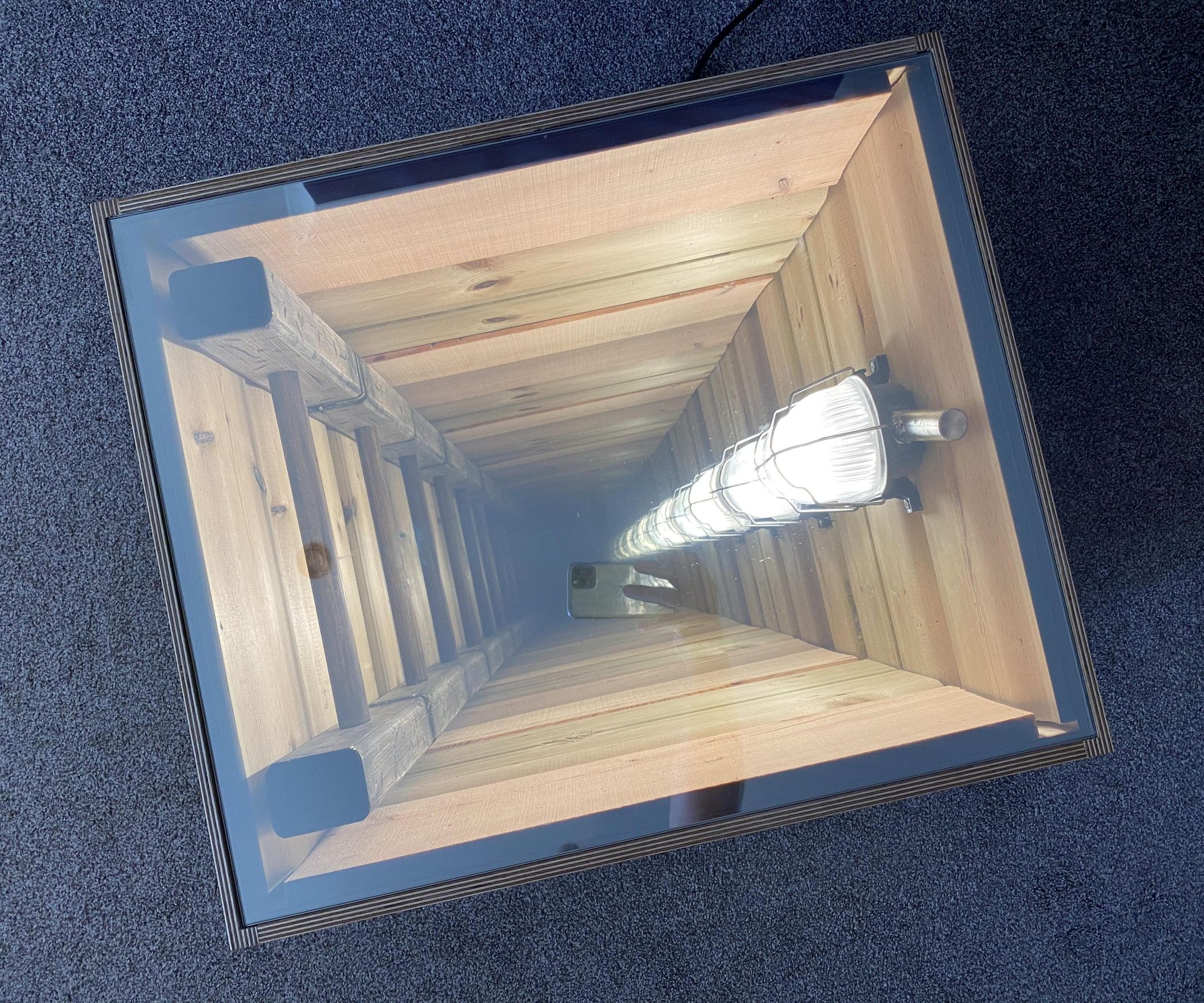 Deep Hole in a Small Box, a Different Take on the Infinity Mirror. 10
