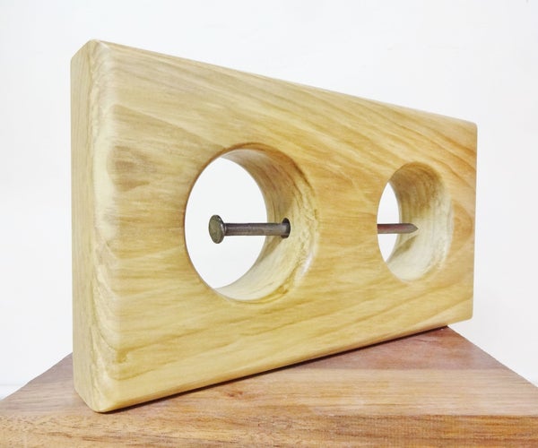 Impossible Nail in Wooden Block