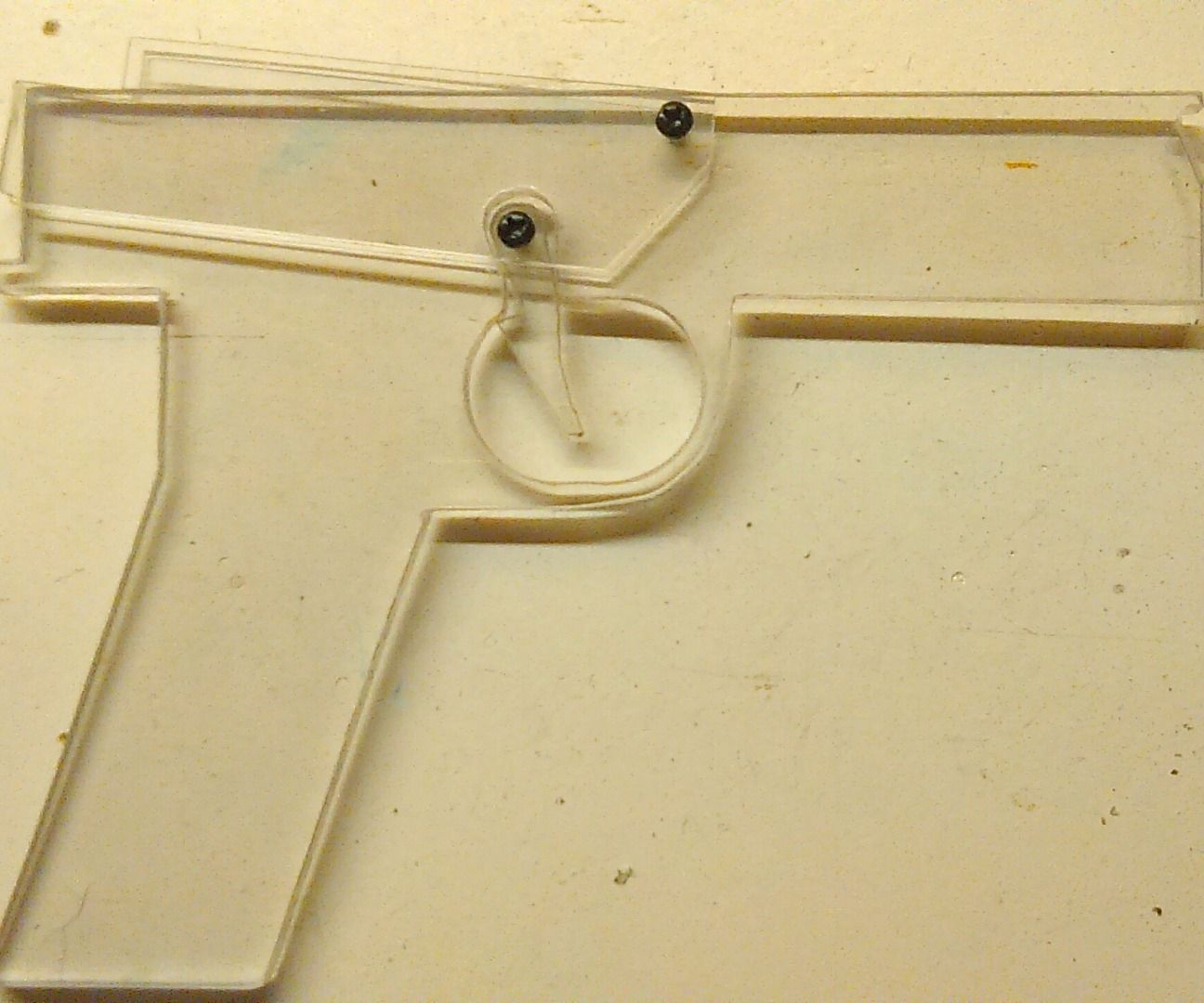 DIY guide for (almost) invisible rubber-band gun with step-by-step instructions