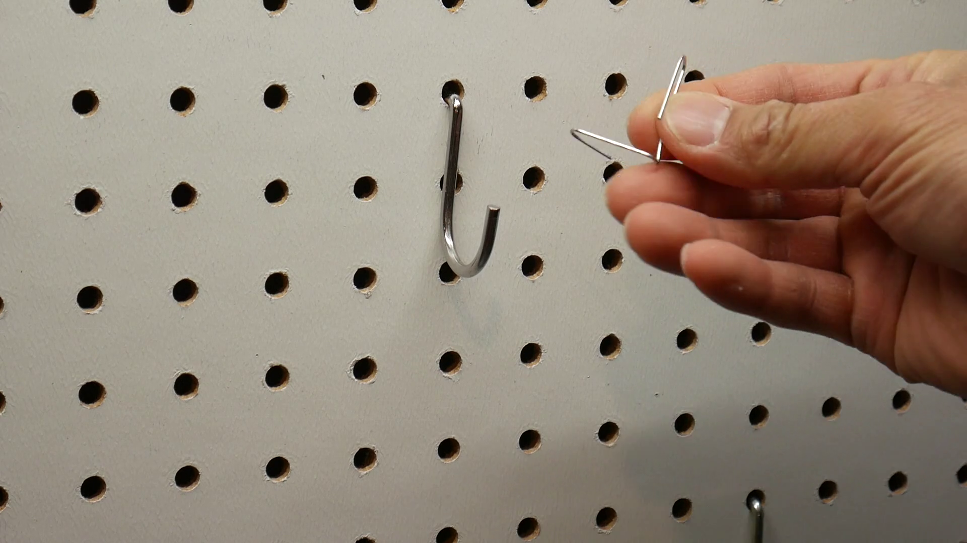 Keep Pegboard Hooks From Falling Out, How to Quickly Secure Any Pegboard Hook With a Paperclip