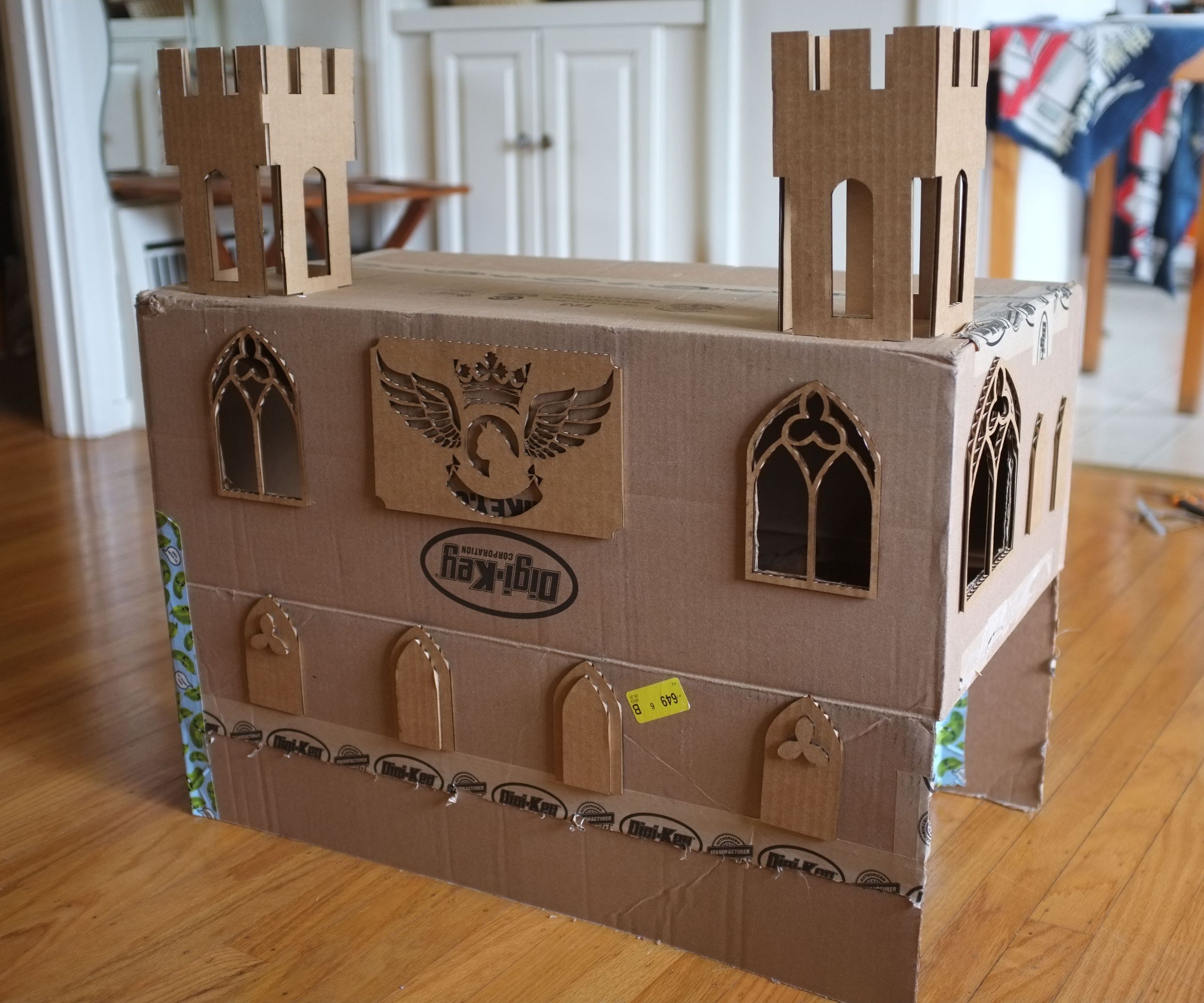 DIY guide for Blinging out a cardboard Cat Fort with step-by-step instructions