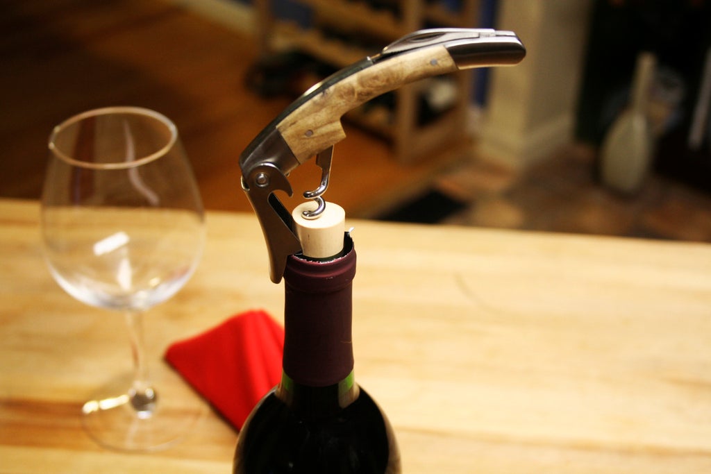 how to open a wine bottle with a key