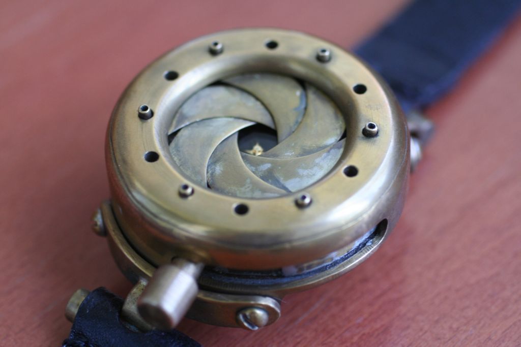 DIY guide for Steampunk wristwatch with mechanical iris cover. "TimEye". with step-by-step instructions