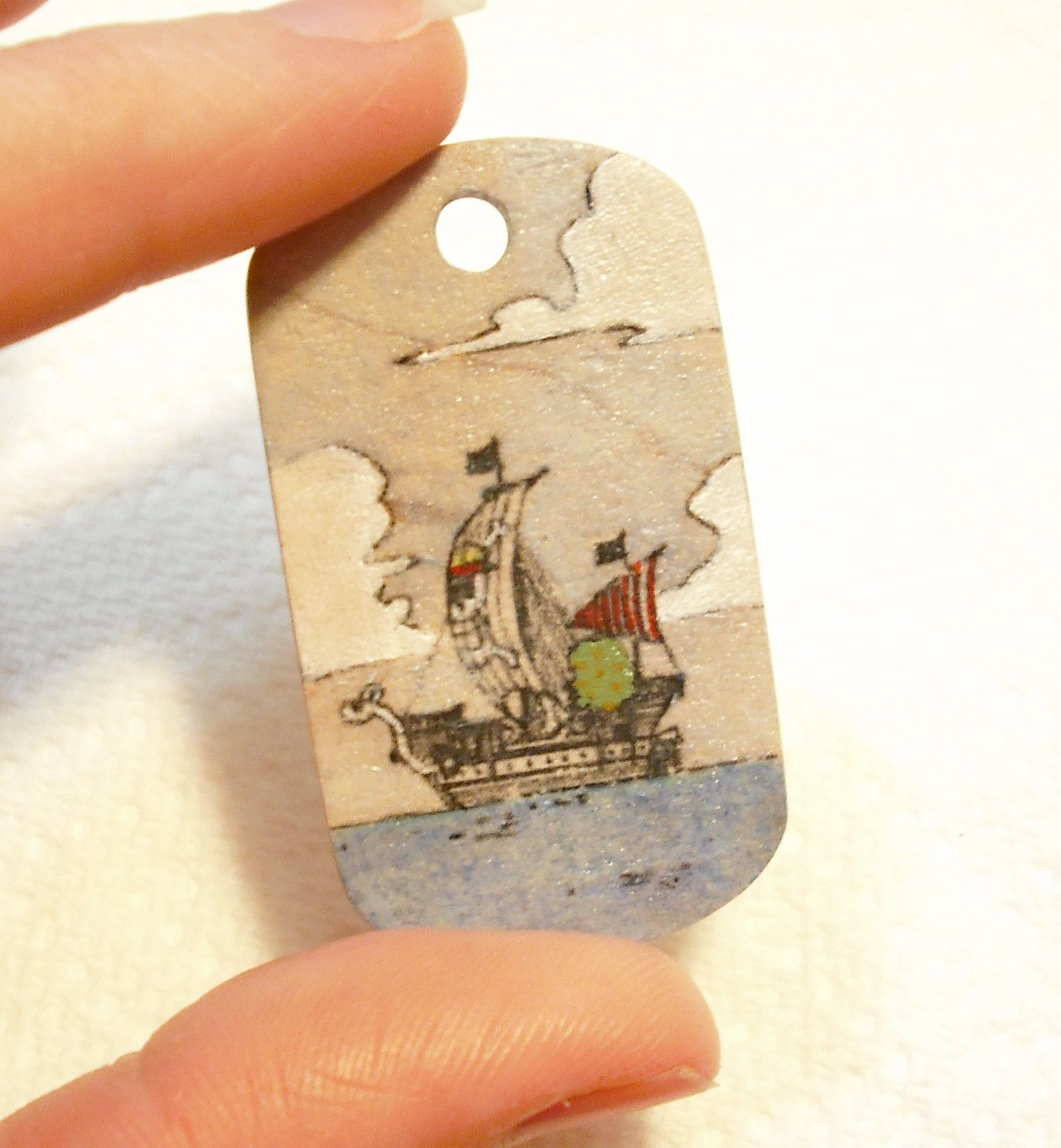 colored comic book image on a wooden dog tag -easy laser printed transfer- DIY Project DIY Project Image
