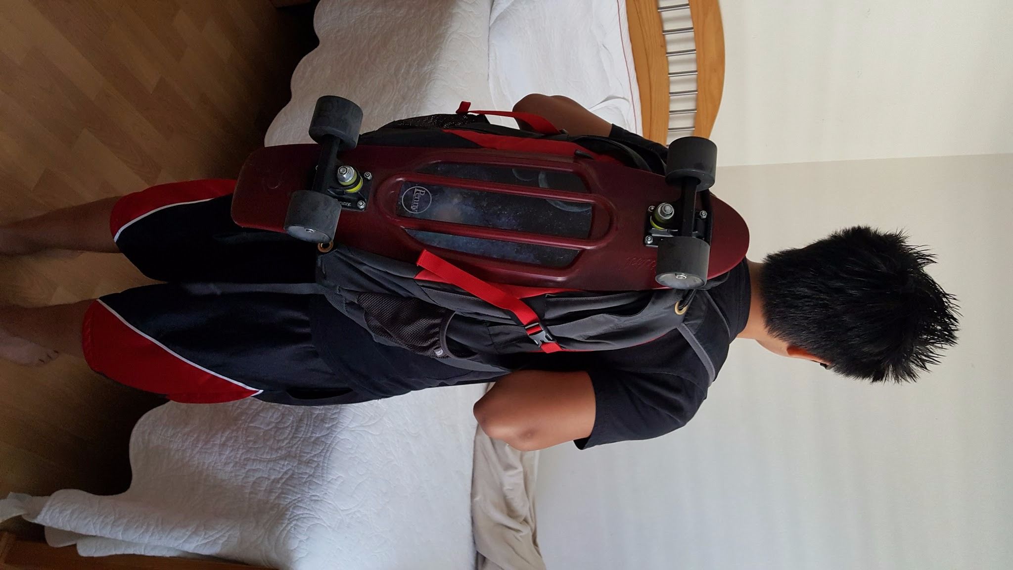 penny board backpack strap