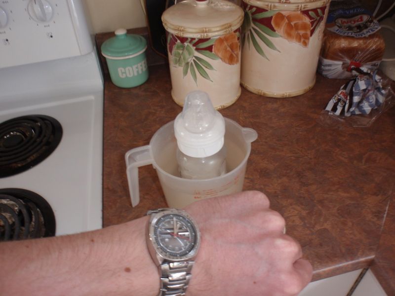 warming bottle on stove