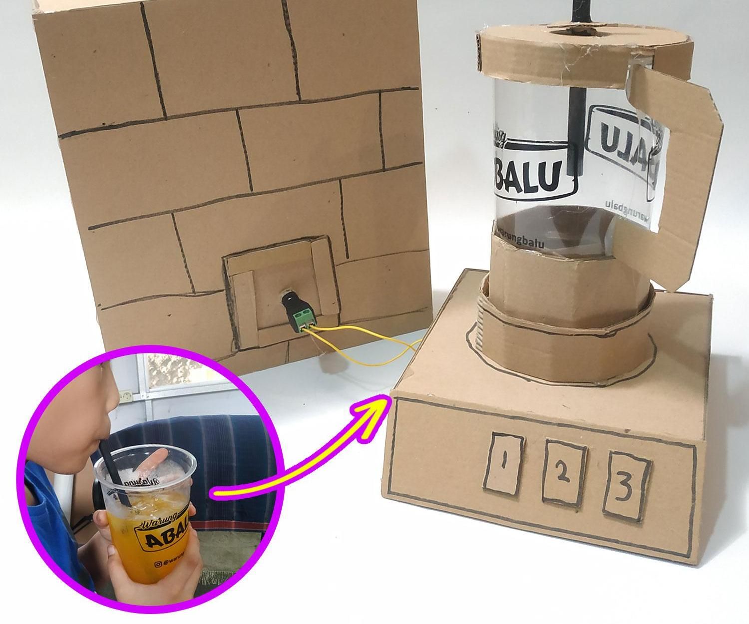Plastic Cup Into Blender With Cardboard